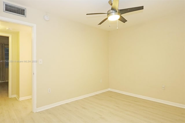 empty room with ceiling fan and light wood-type flooring