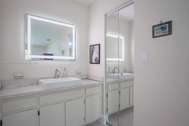 bathroom featuring tiled shower, vanity, toilet, and tile walls