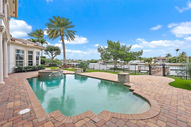 view of pool with an in ground hot tub and a patio