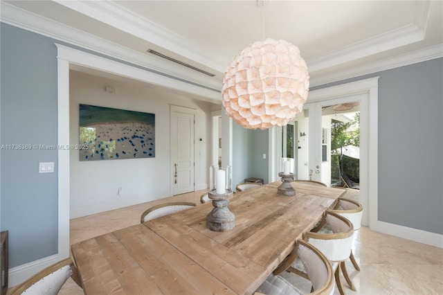 dining room featuring crown molding