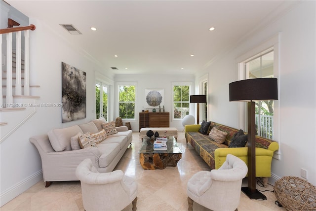 living room with ornamental molding