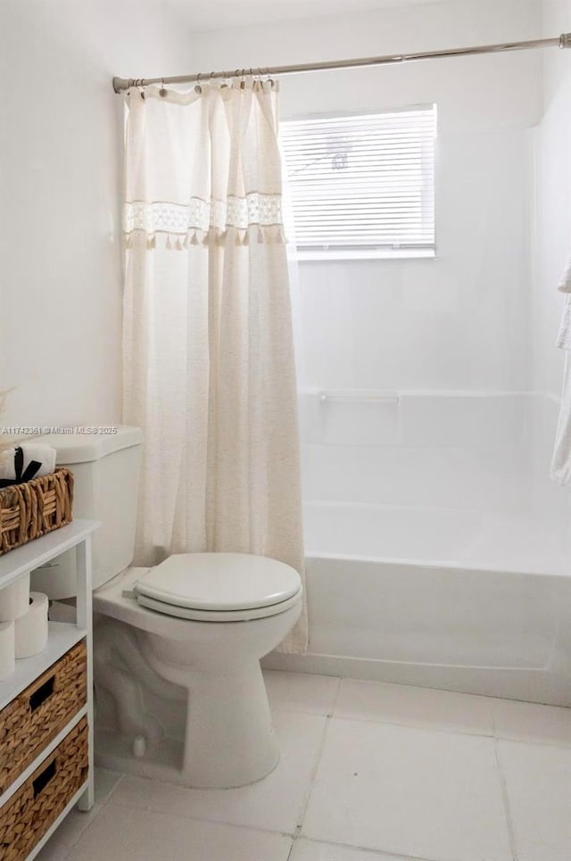 2260 Charleston St, Hollywood, FL 33020 - bathroom featuring shower / bath combination with curtain and toilet