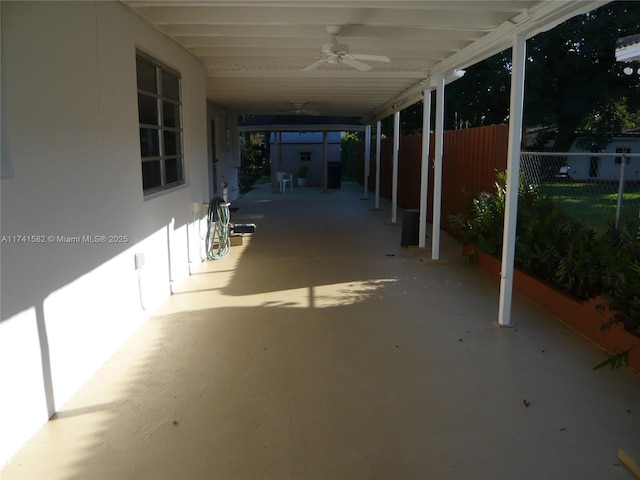 view of patio featuring ceiling fan