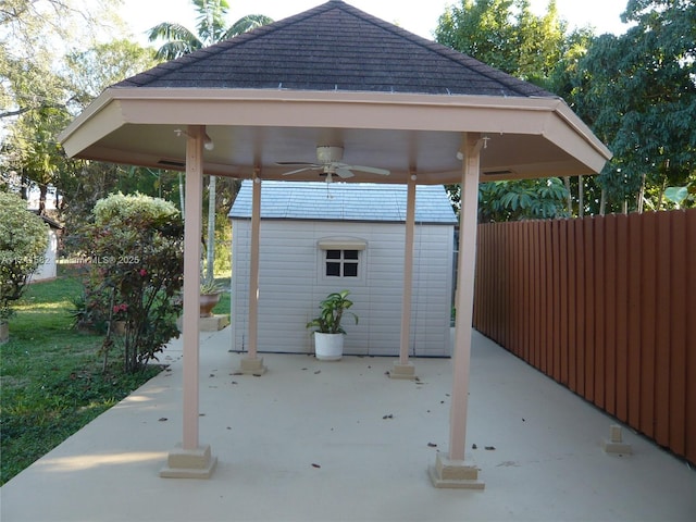 view of patio / terrace featuring a gazebo, an outdoor structure, and ceiling fan