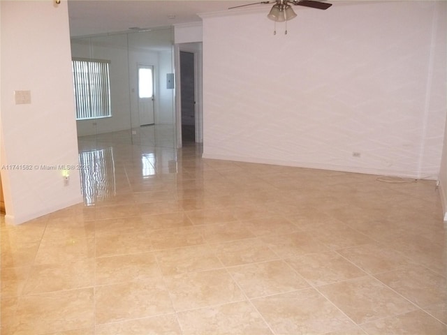 unfurnished room with ceiling fan, ornamental molding, and lofted ceiling