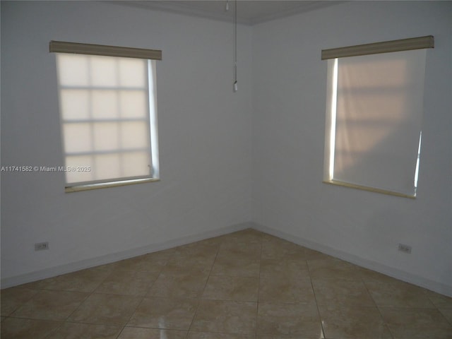 unfurnished room featuring light tile patterned floors