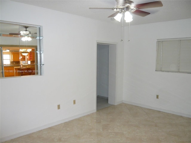 unfurnished room featuring ceiling fan