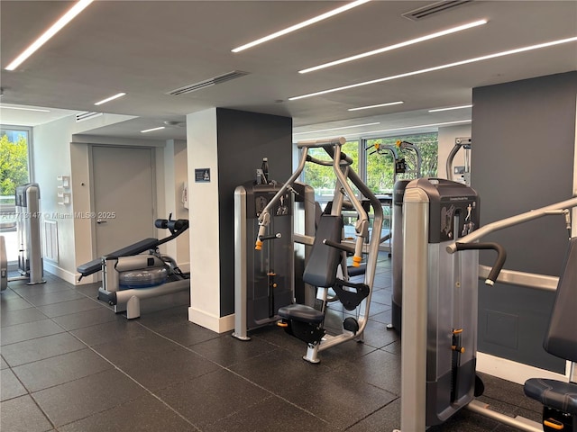 workout area featuring visible vents and baseboards