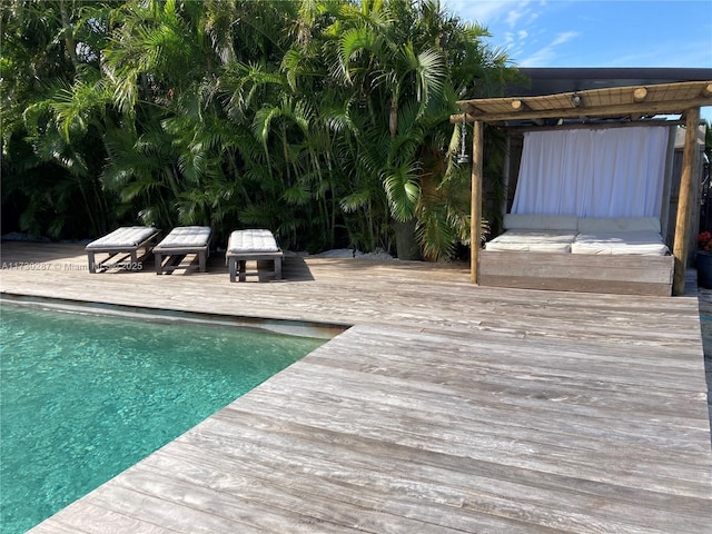 view of swimming pool featuring a deck