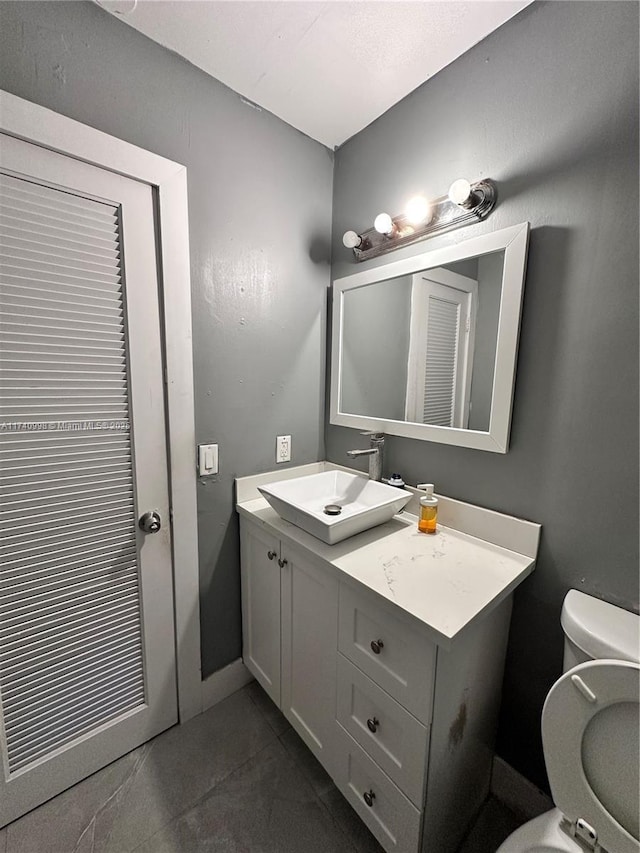 5895 NW 12th Ave, Miami, FL 33127 - bathroom featuring vanity, toilet, and tile patterned flooring