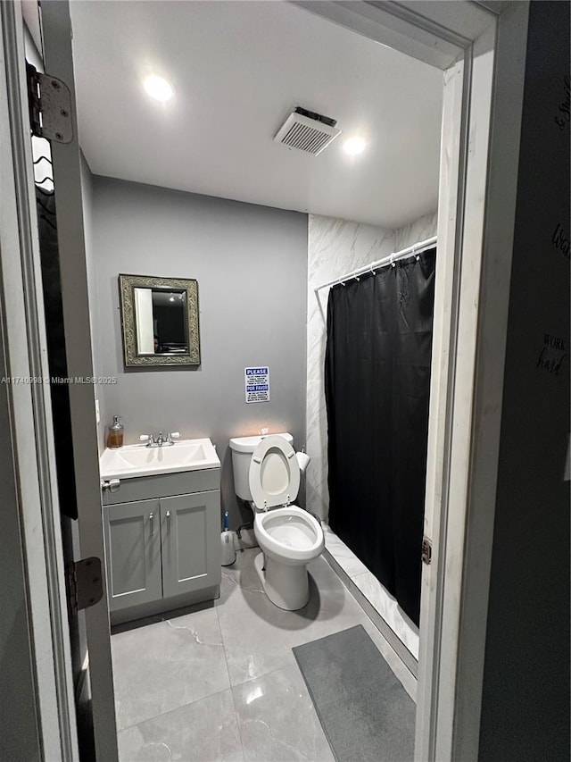 5895 NW 12th Ave, Miami, FL 33127 - bathroom with vanity, toilet, and a shower with shower curtain