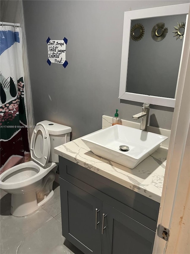 5895 NW 12th Ave, Miami, FL 33127 - bathroom featuring vanity, tile patterned flooring, and toilet