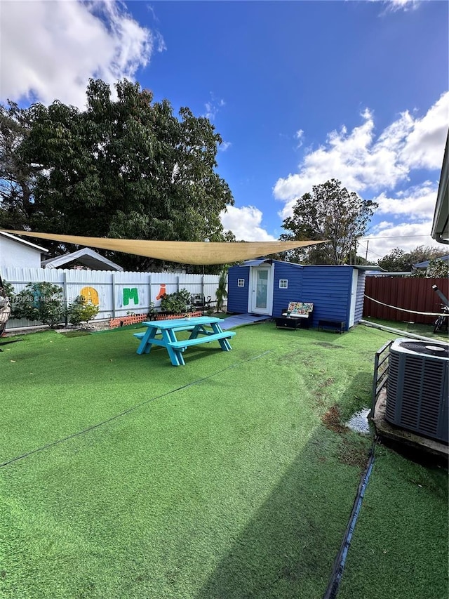 5895 NW 12th Ave, Miami, FL 33127 - view of yard featuring cooling unit and a storage unit