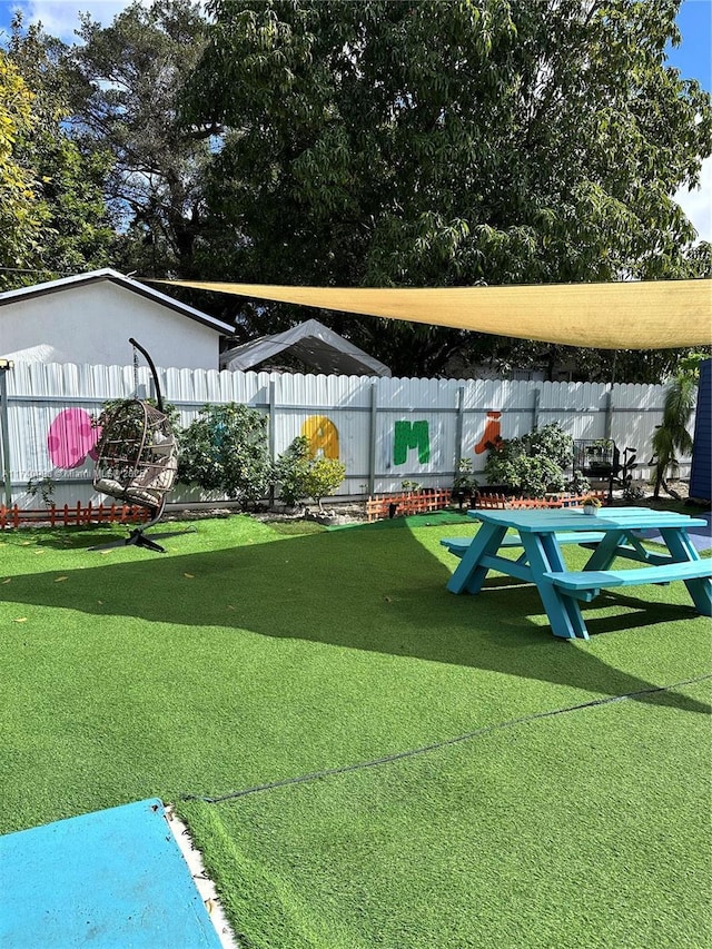5895 NW 12th Ave, Miami, FL 33127 - view of home's community with a lawn