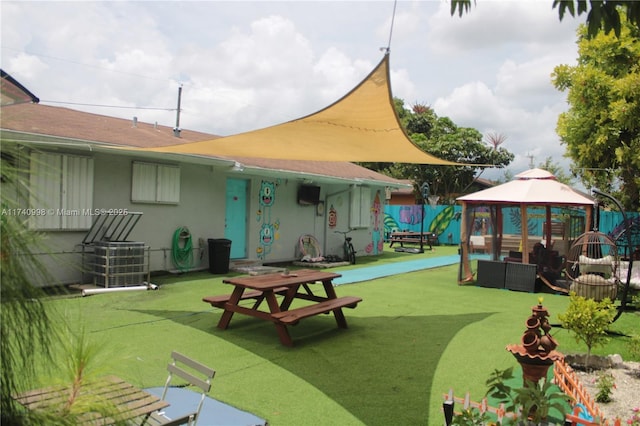 5895 NW 12th Ave, Miami, FL 33127 - view of community featuring a gazebo, outdoor lounge area, and a lawn