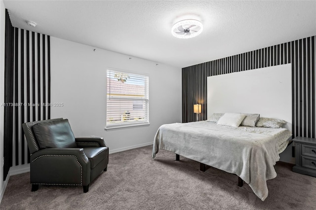 bedroom featuring carpet and a textured ceiling