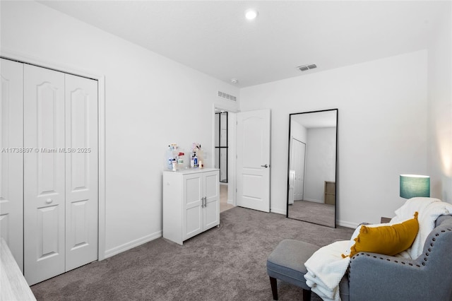 sitting room featuring light colored carpet