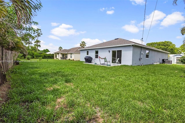 rear view of house with a lawn