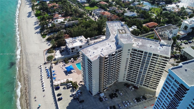 aerial view featuring a water view and a beach view