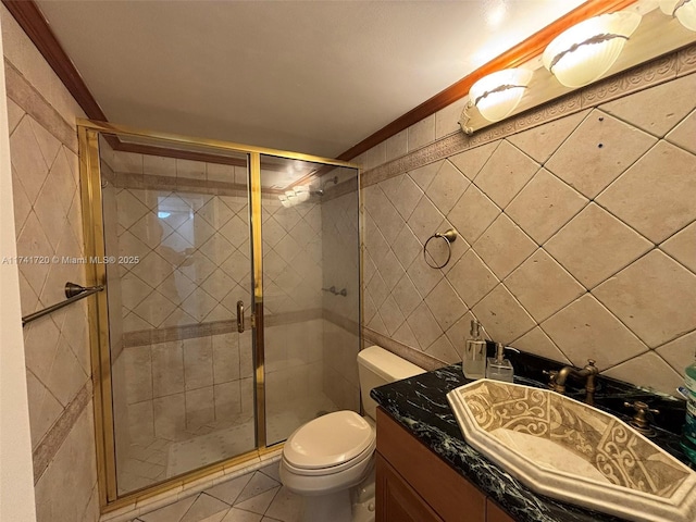 bathroom featuring tile walls, an enclosed shower, vanity, and toilet