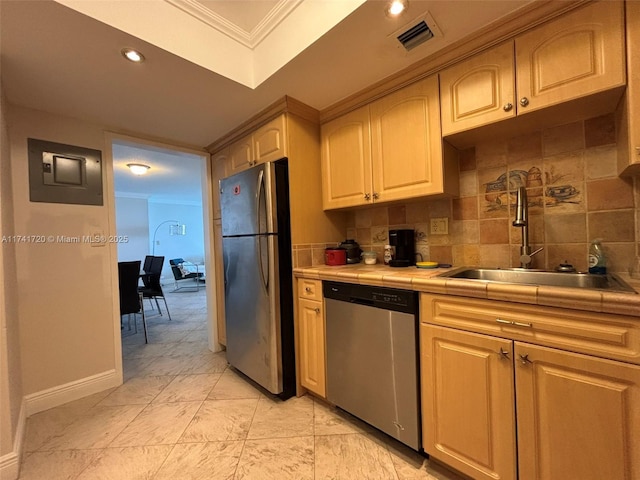 kitchen with tasteful backsplash, sink, tile counters, electric panel, and stainless steel appliances