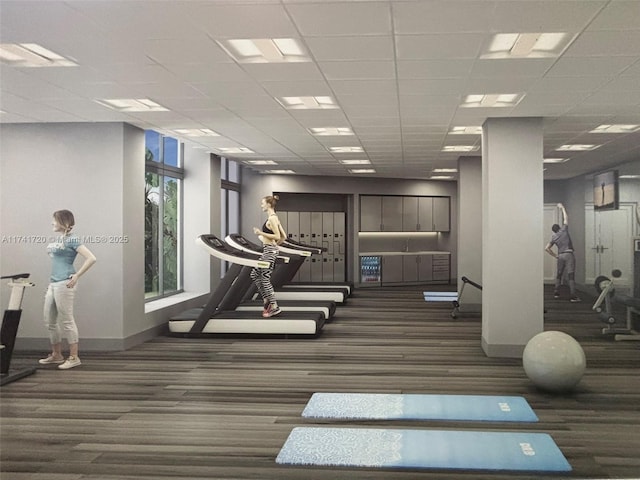 exercise room with a paneled ceiling