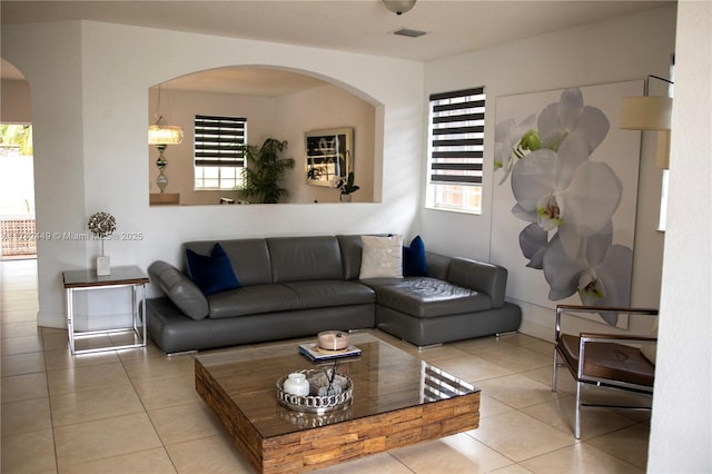 living room with a healthy amount of sunlight and light tile patterned floors