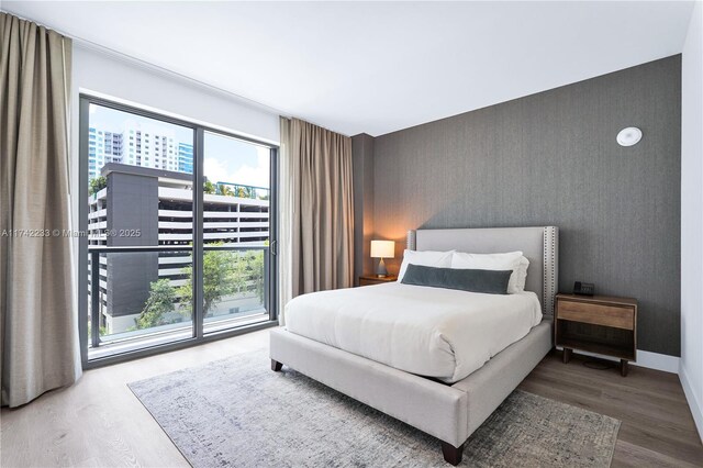 bedroom with hardwood / wood-style flooring