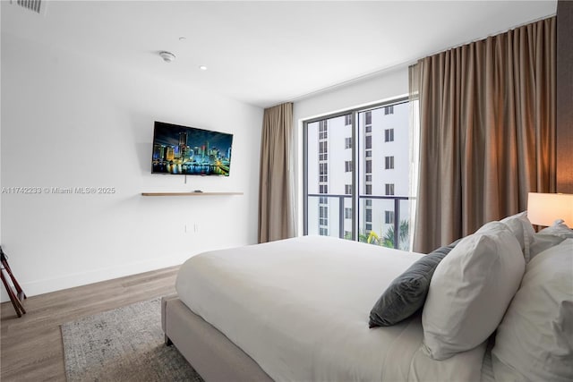 bedroom featuring hardwood / wood-style floors