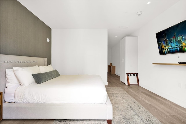 bedroom featuring light hardwood / wood-style floors