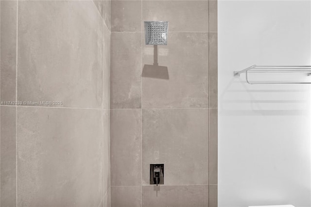 room details with a tile shower