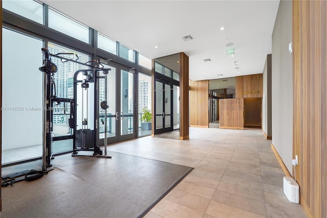 interior space featuring floor to ceiling windows and french doors