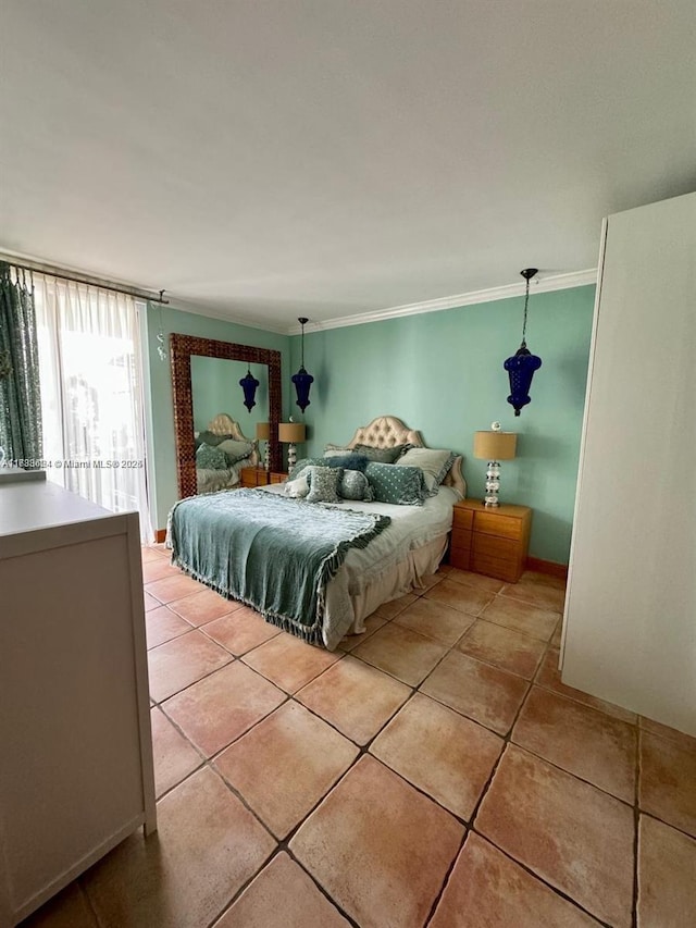 bedroom featuring ornamental molding and light tile patterned floors