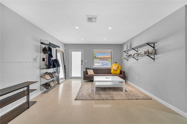 living room with light tile patterned flooring