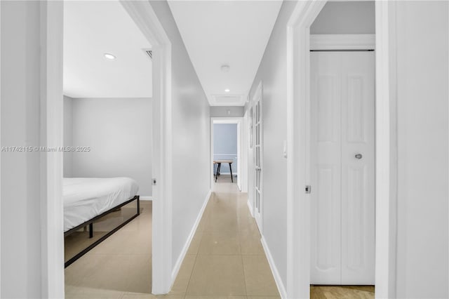 hallway featuring light tile patterned floors