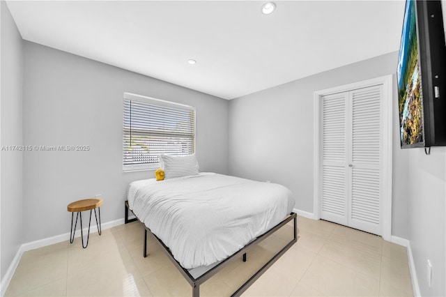 tiled bedroom with a closet