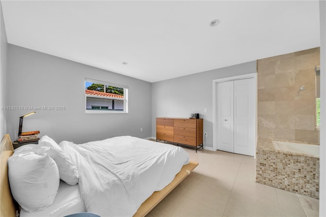 tiled bedroom featuring a closet