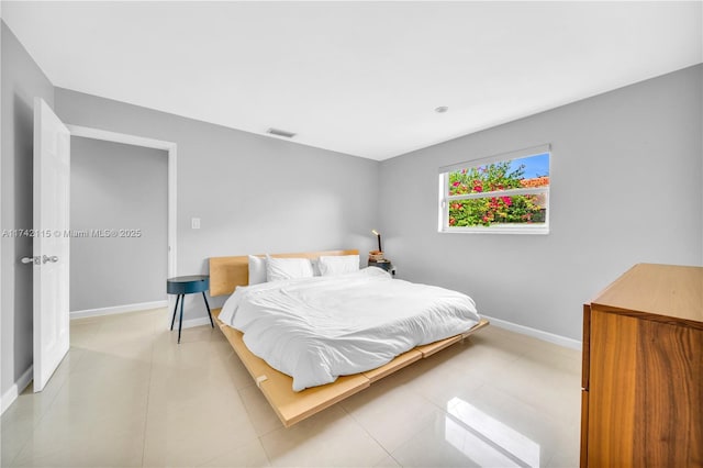 bedroom featuring light tile patterned floors