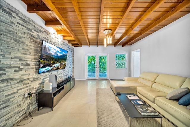 tiled living room featuring beam ceiling, wood ceiling, a stone fireplace, and french doors