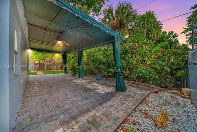 patio terrace at dusk with ceiling fan