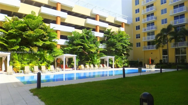 view of pool with a gazebo, a lawn, a patio area, and a pergola