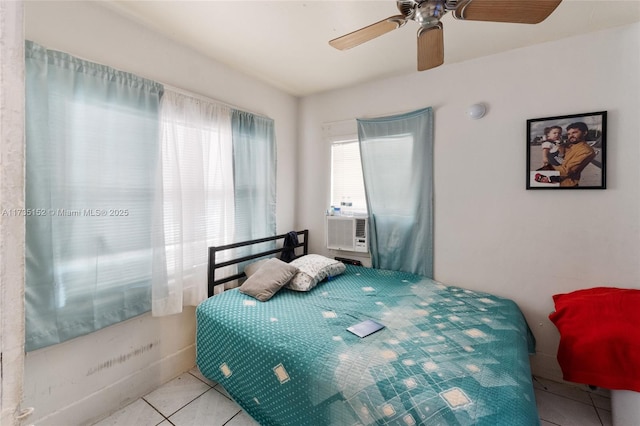 tiled bedroom with cooling unit and ceiling fan