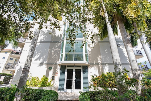 rear view of property with french doors