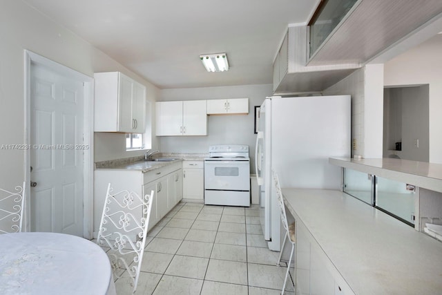 kitchen with white cabinetry, white appliances, sink, and light tile patterned floors