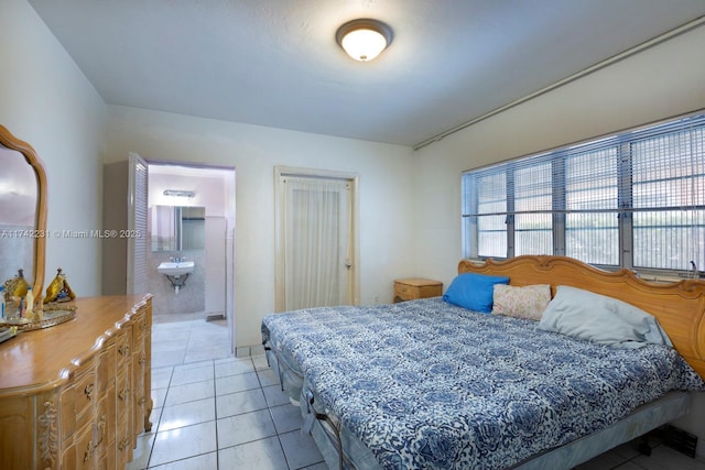 tiled bedroom featuring sink