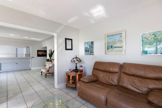 tiled living room with a textured ceiling