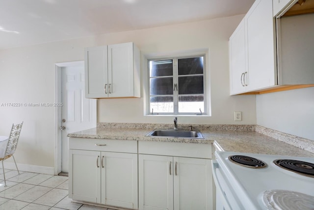 kitchen with sink, light tile patterned floors, white cabinets, and white range with electric cooktop