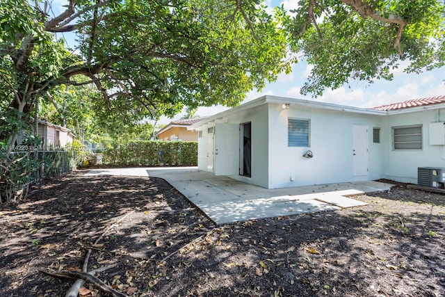 back of property featuring central AC unit and a patio area