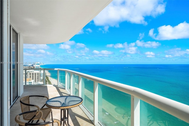 balcony featuring a water view