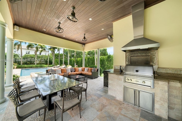 view of patio / terrace with area for grilling, outdoor lounge area, and an outdoor kitchen